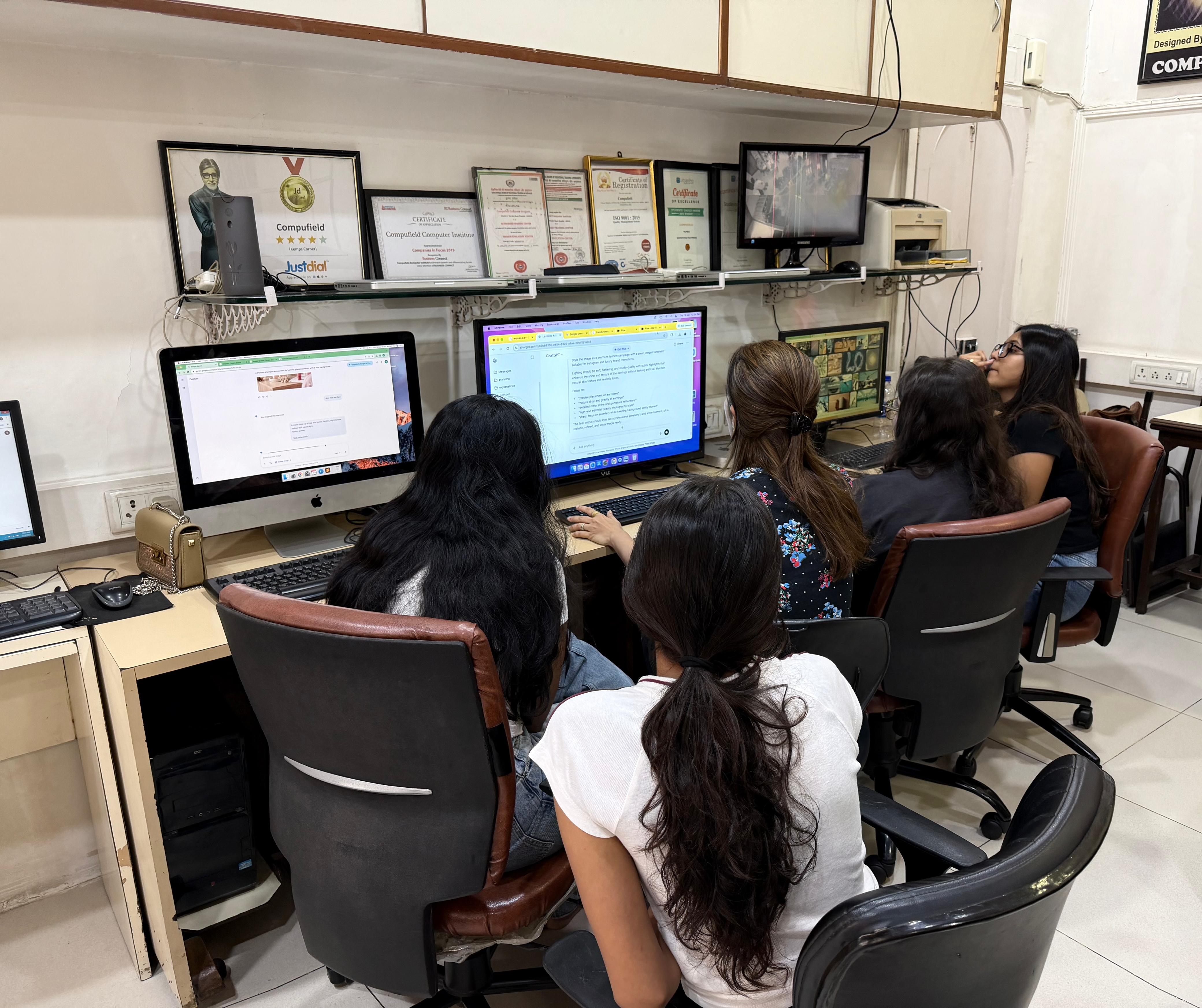 Students working on computers at Compufield