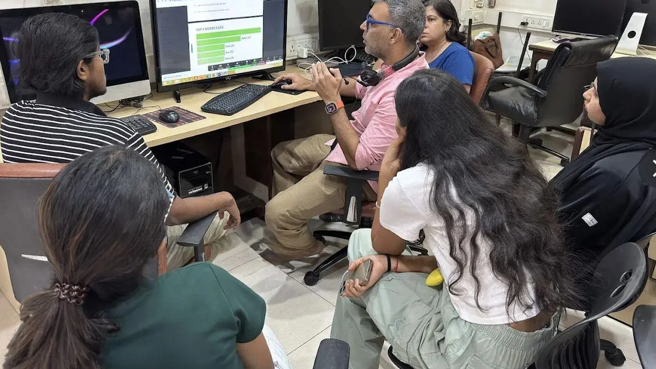 Trainer working one-to-one with students at Kemps Corner